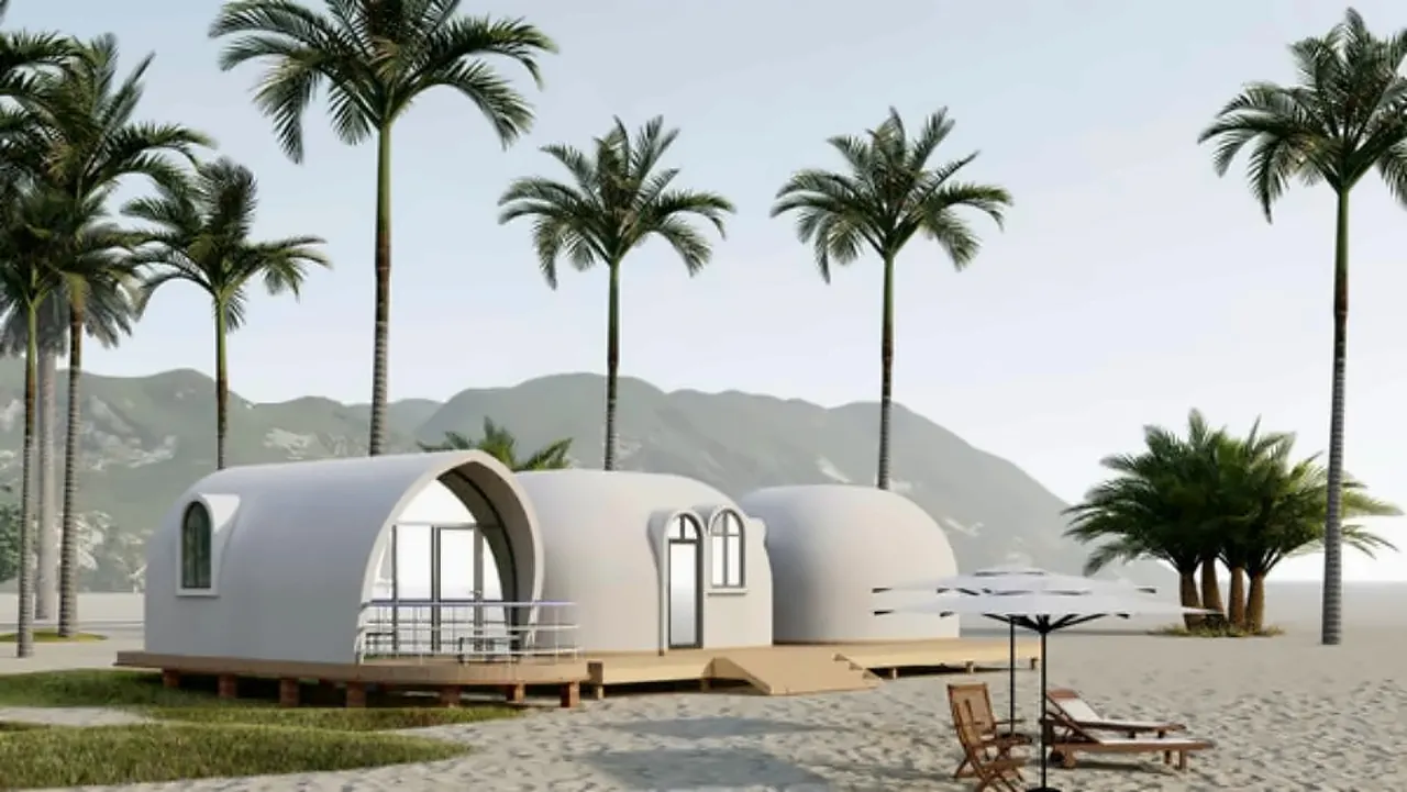 Linked pair of EPS dome cabins sharing one deck in a beachfront setting — concept rendering